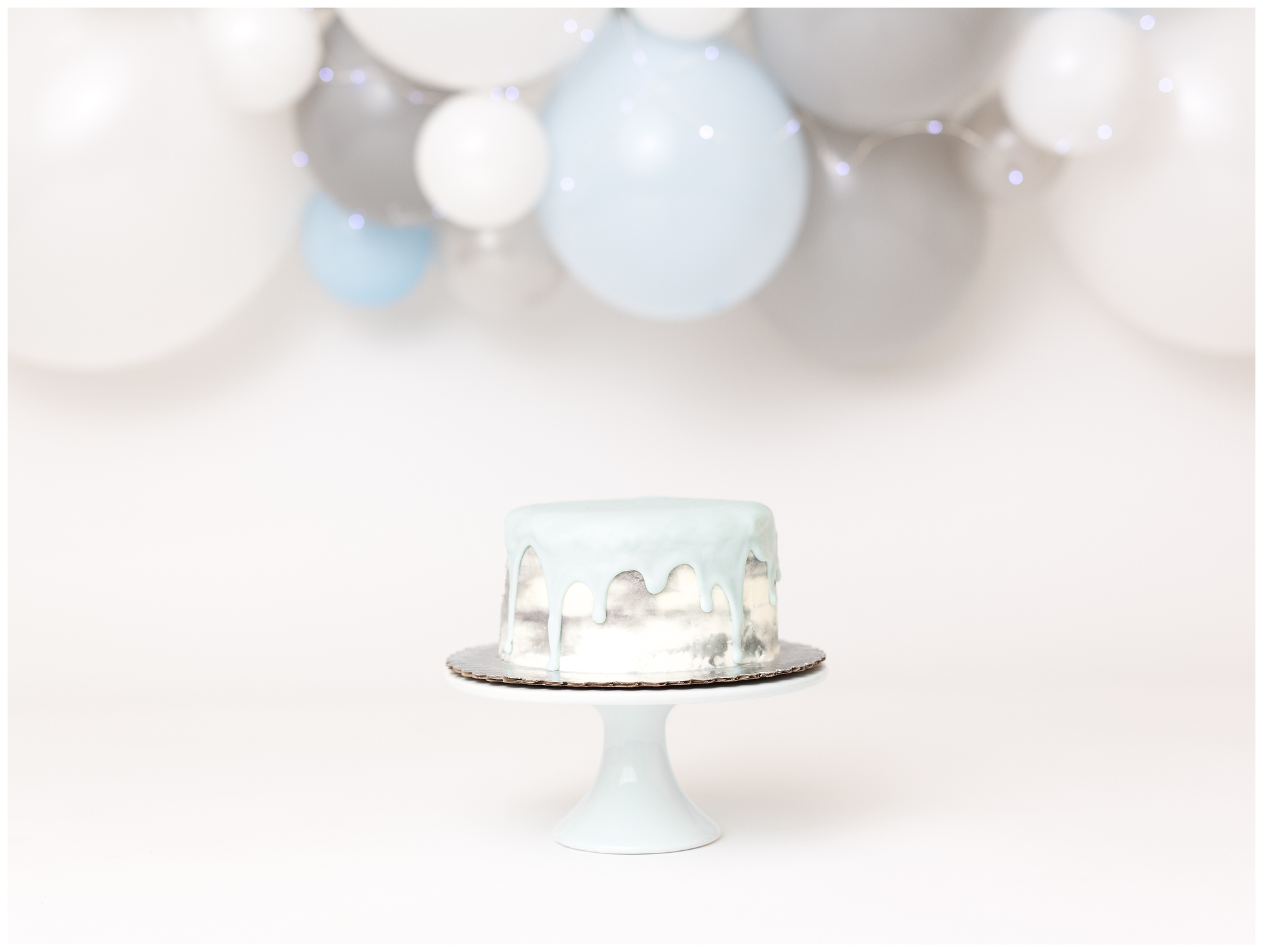 DIY balloon garland grey white blue watercolor cake